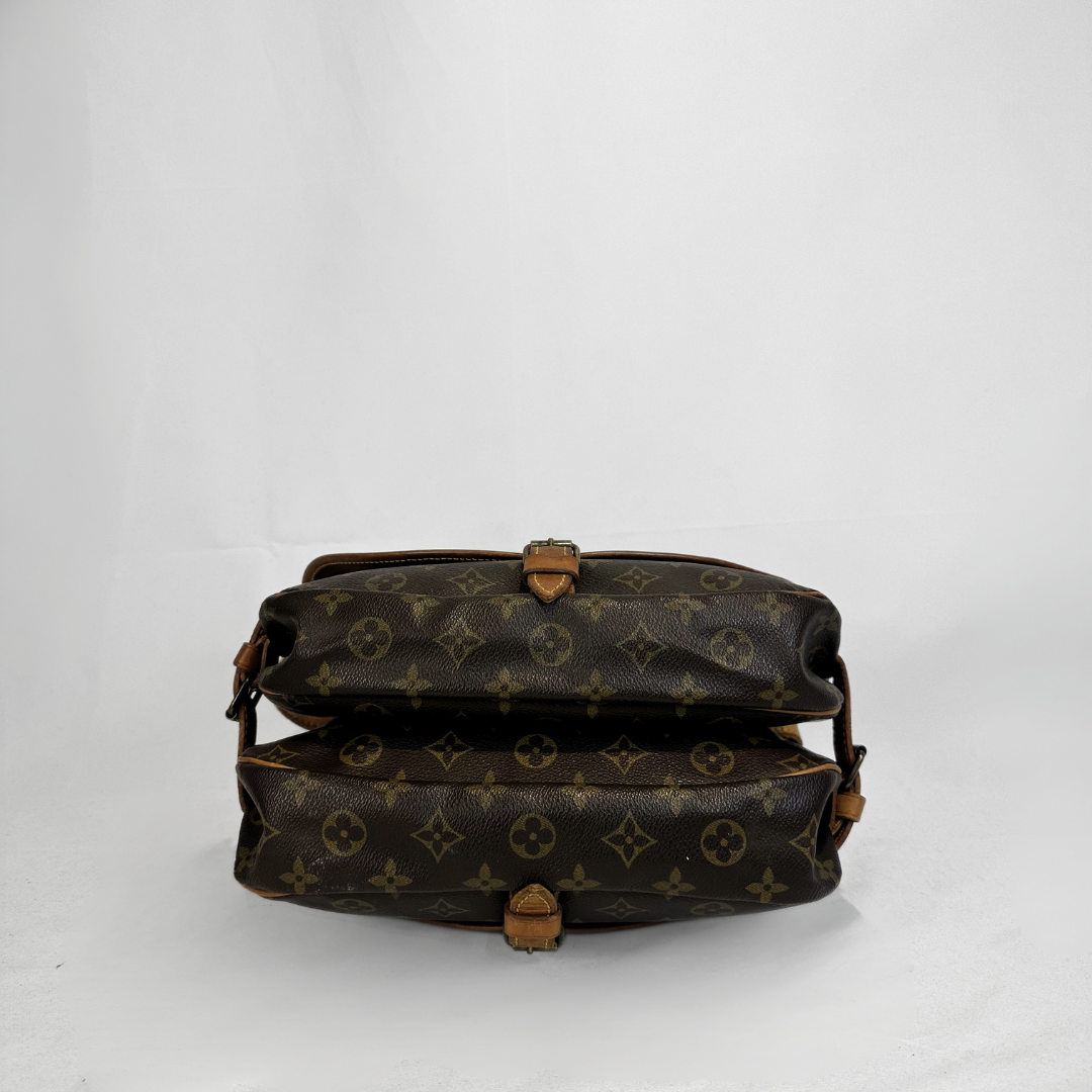 A vintage Louis Vuitton monogram shoulder bag in brown coated canvas with tan leather trim, shown from the back against a plain white background.