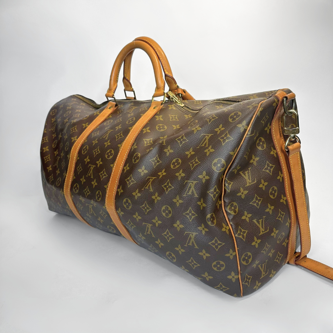 Louis Vuitton monogram duffel bag on a white background