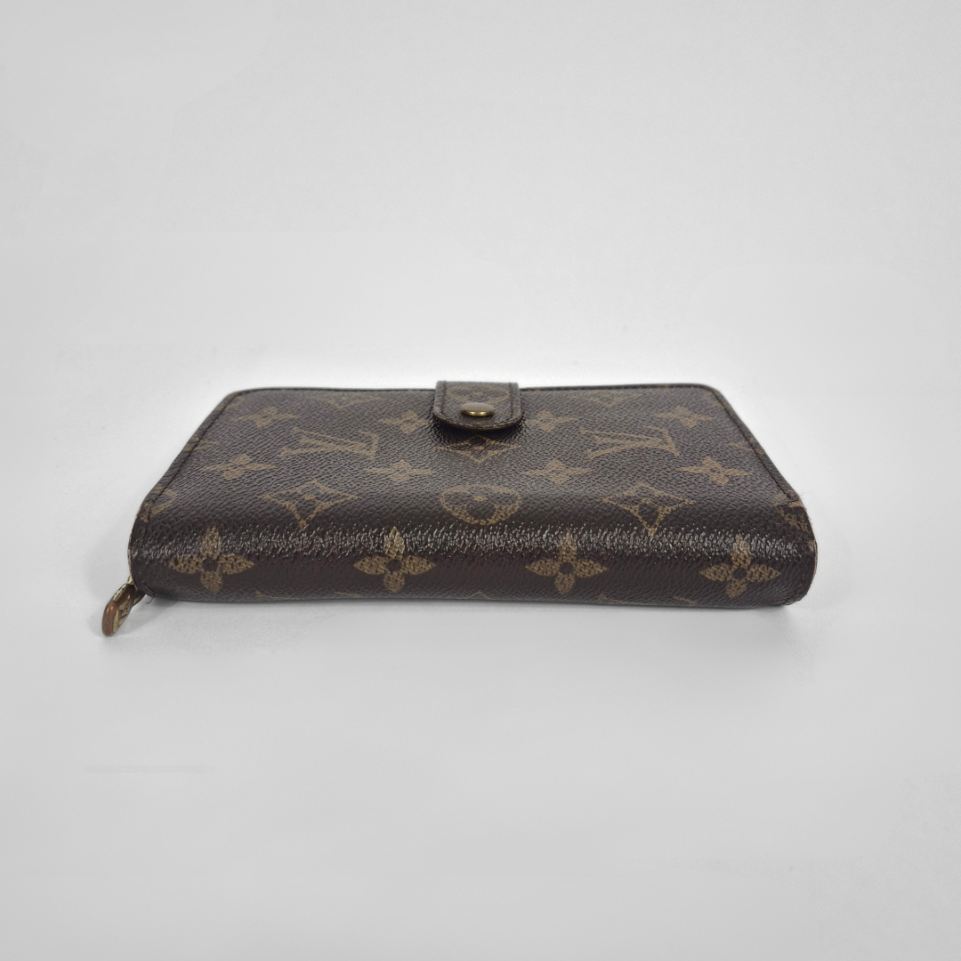 Brown wallet with monogram pattern on a white background