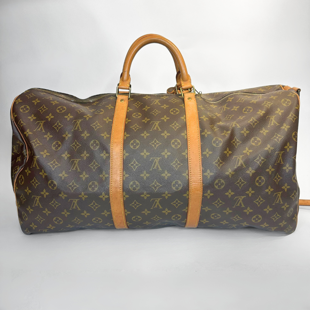 Louis Vuitton monogram duffel bag on a white background