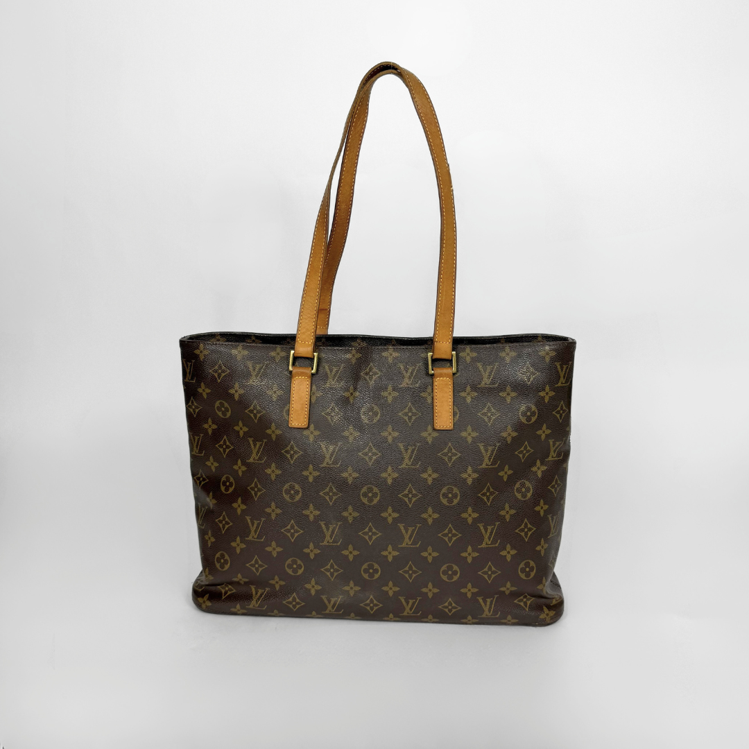Designer handbag with monogram pattern on a white background