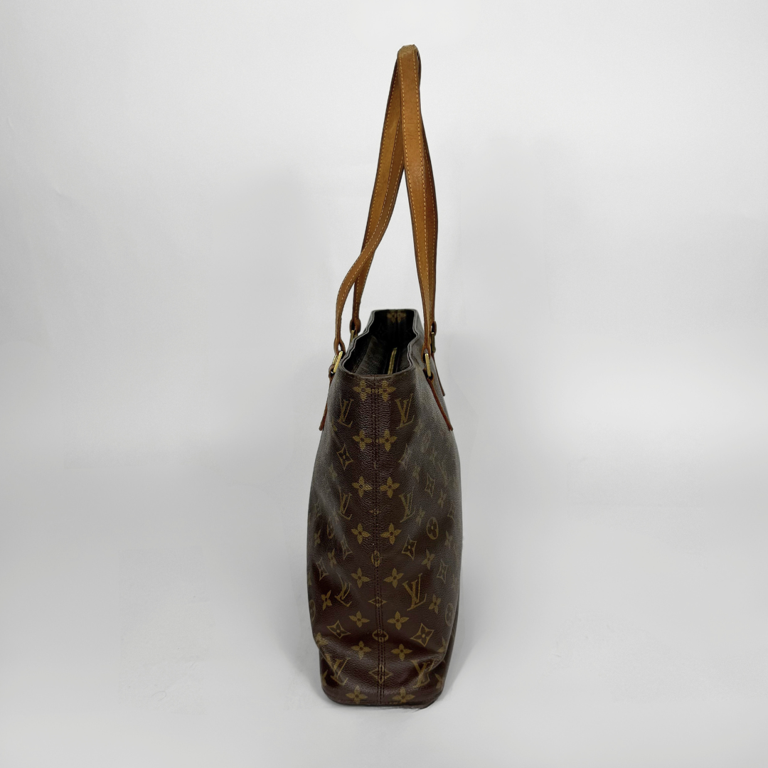 Brown handbag with visible brand logo on a white background