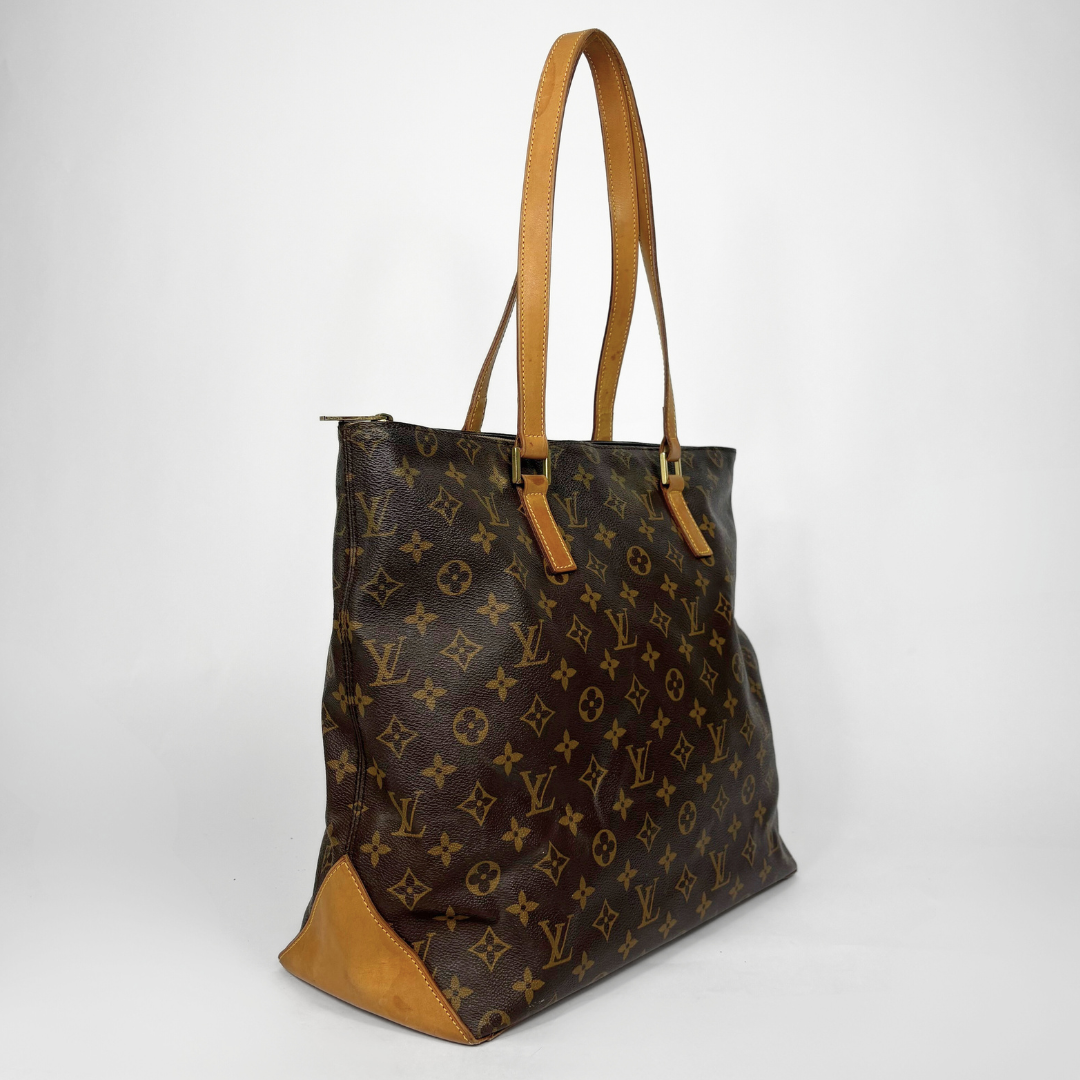 Designer handbag with monogram pattern on a white background