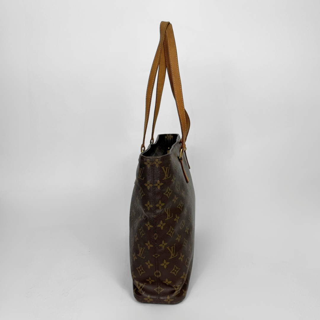 Brown handbag with visible brand logo on a white background