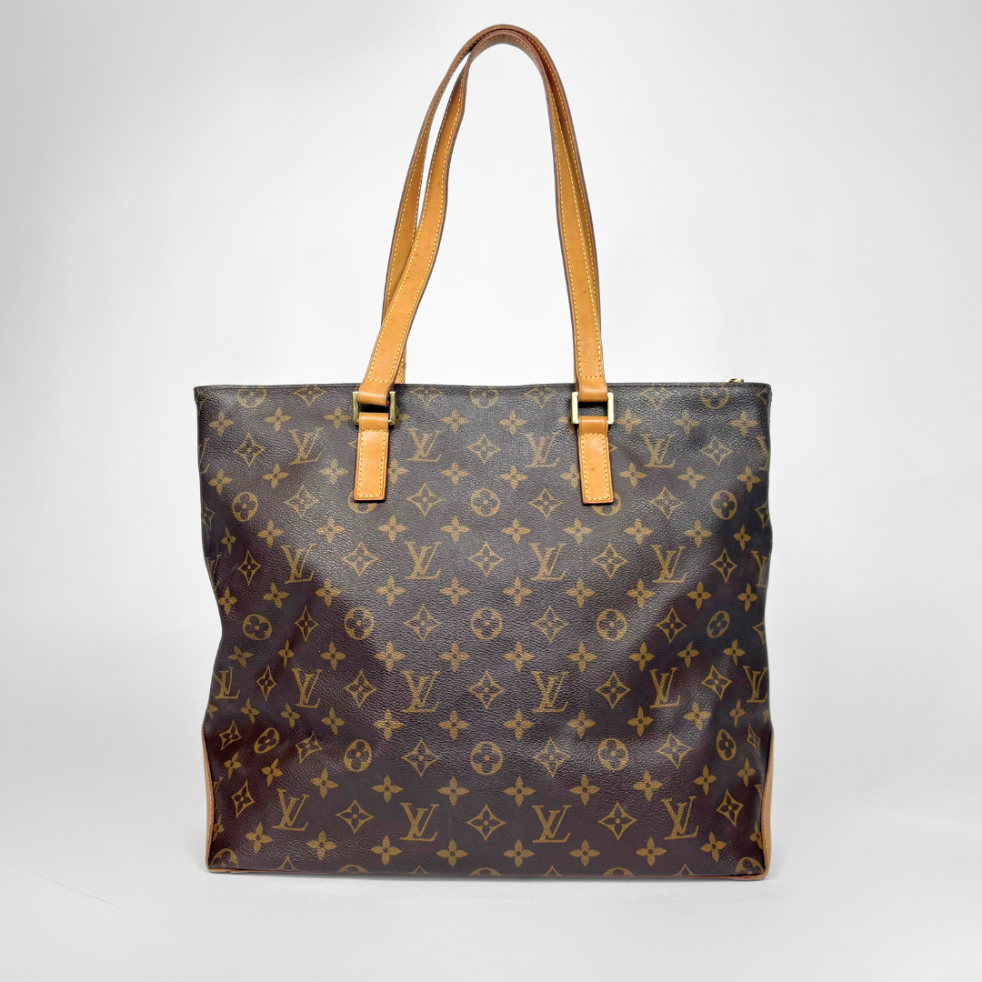 Designer handbag with monogram pattern on a white background