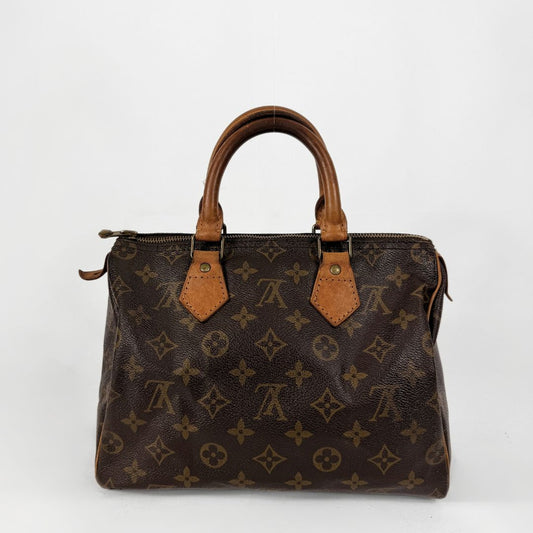 A classic Louis Vuitton monogram canvas handbag with brown leather handles and trim, photographed against a plain white background.