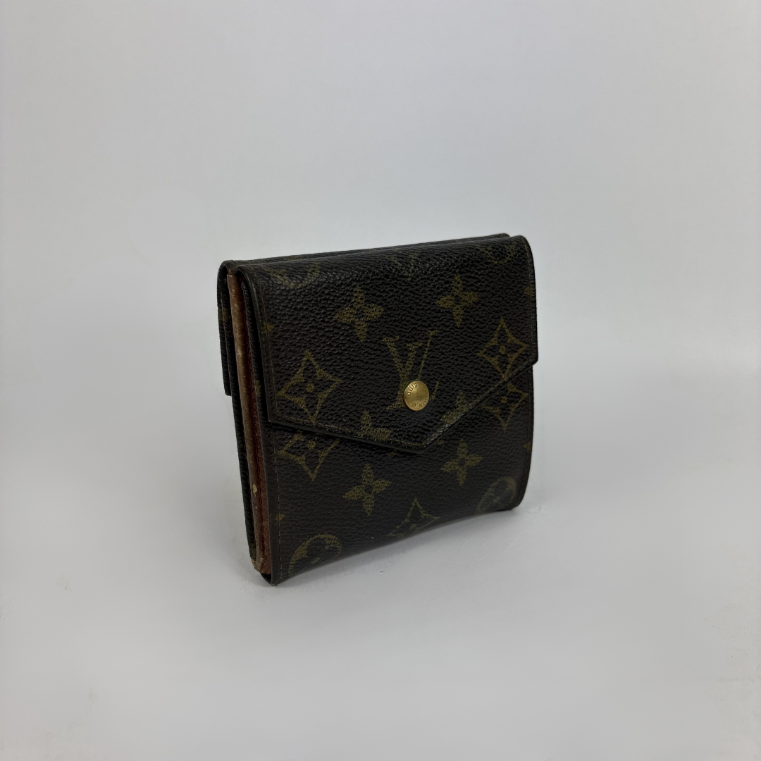 Louis Vuitton Druk Wallet on a white background