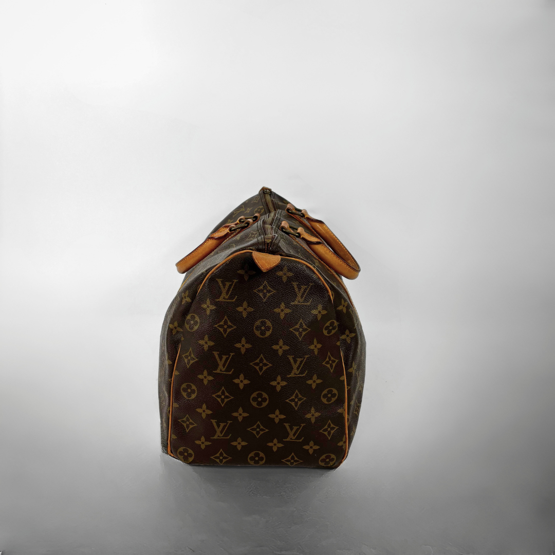Louis Vuitton monogram bag on a gray background