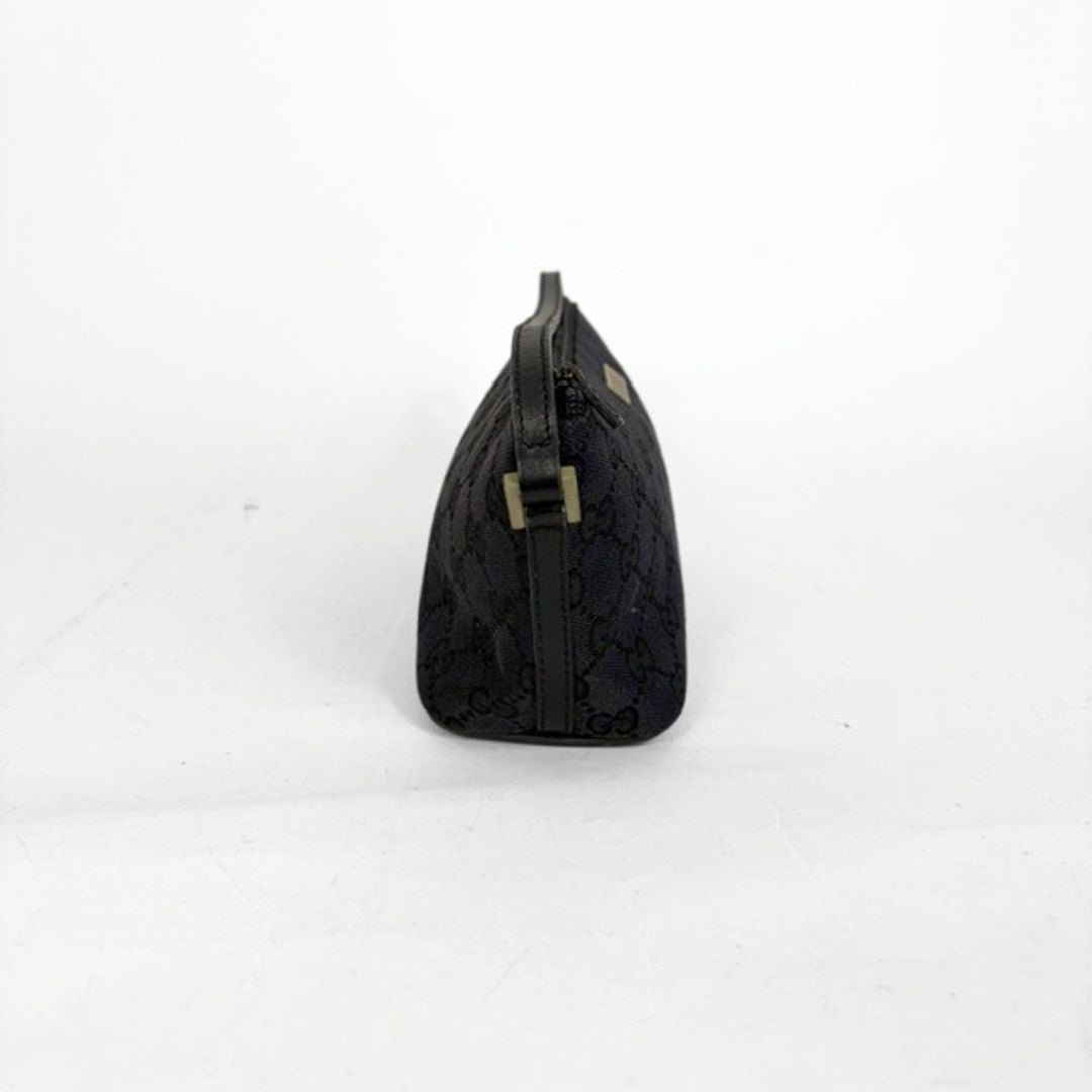 Black textured pouch with a gold buckle on a white background
