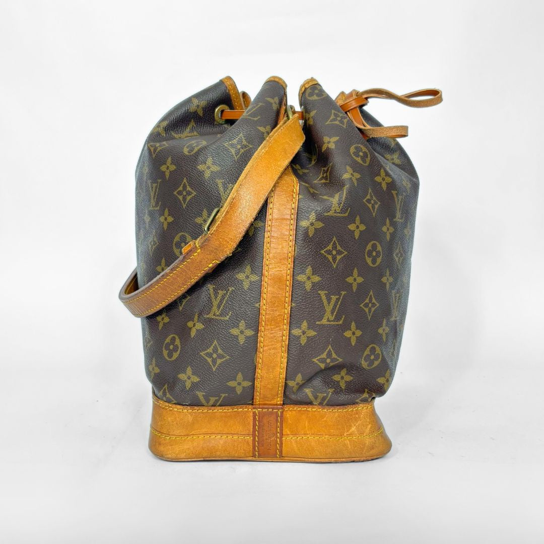 Designer handbag with monogram pattern on a white background