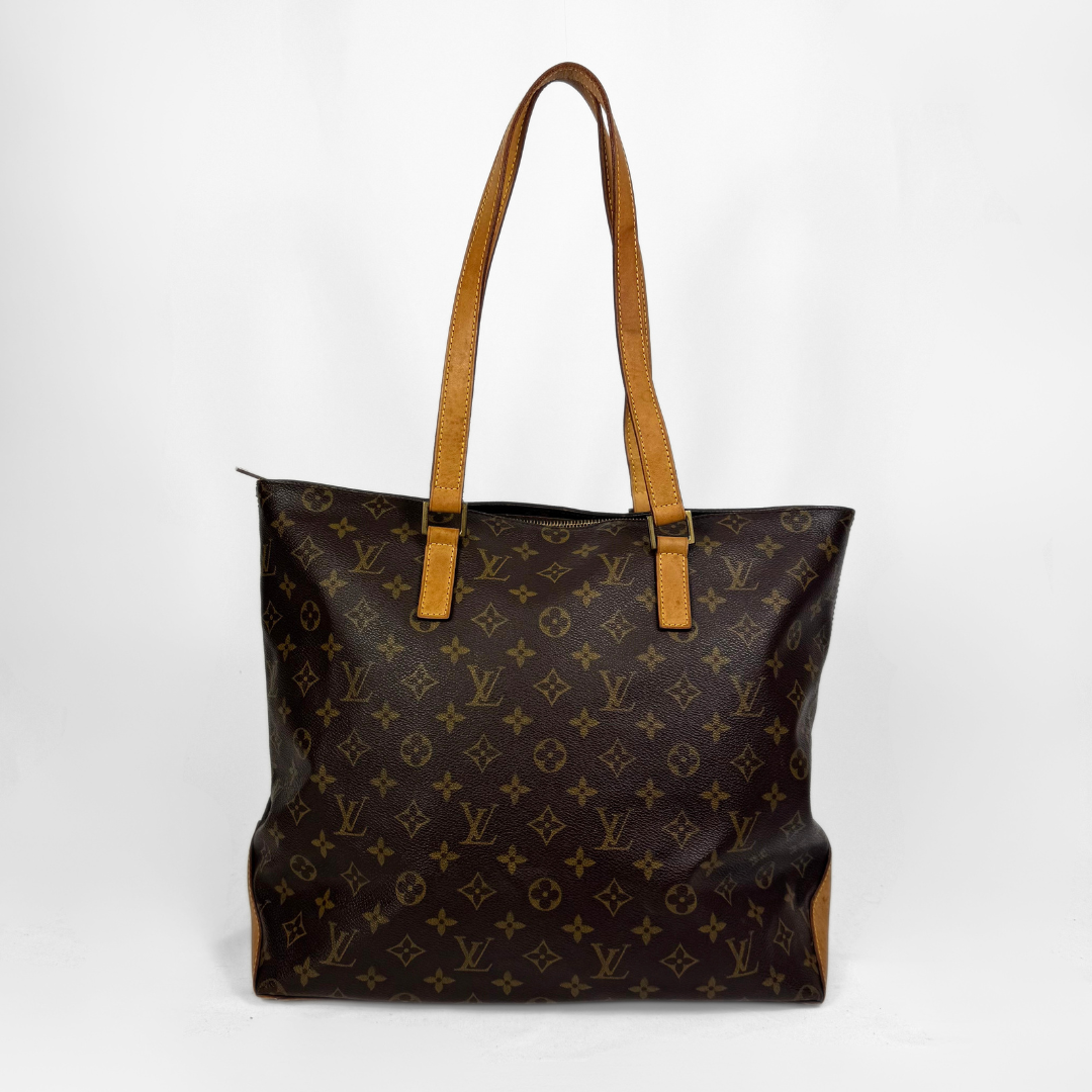 A Louis Vuitton monogram canvas tote bag with tan leather shoulder straps, shown against a plain white background.