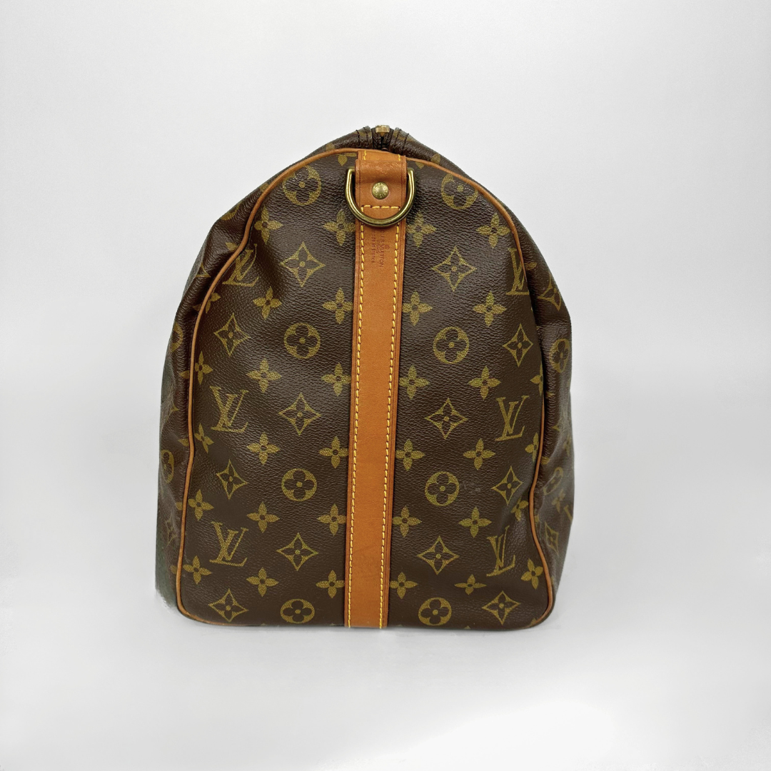 Brown Louis Vuitton bag with monogram pattern on a white background