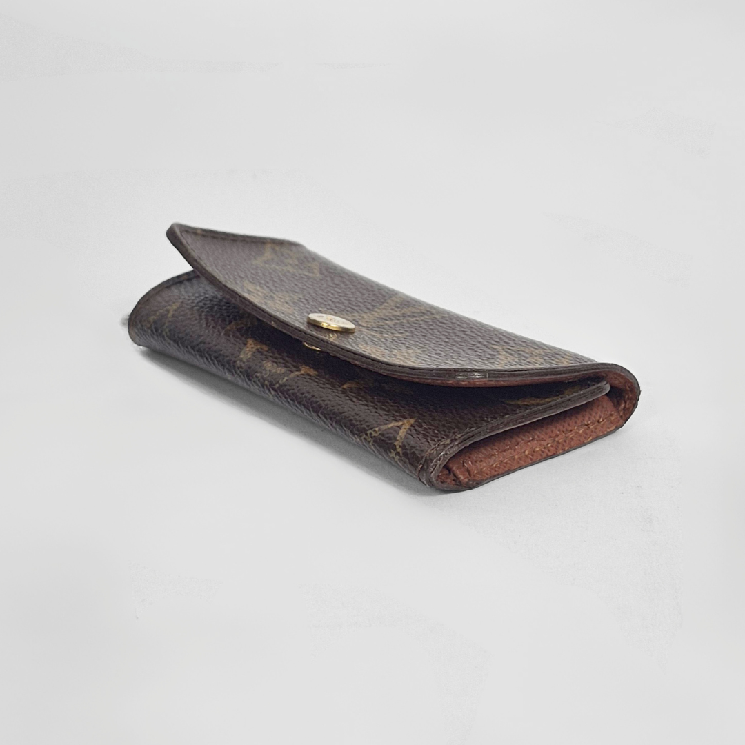 Brown leather wallet on a light gray background
