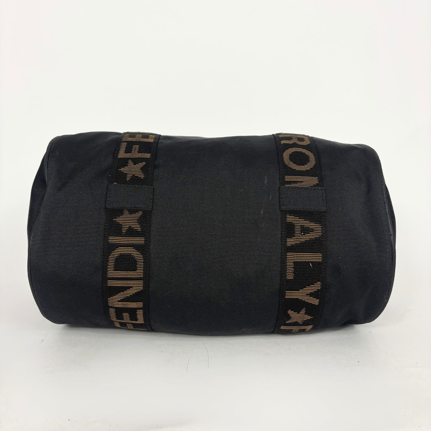 Black duffel bag with 'FENDI' logo on a white background