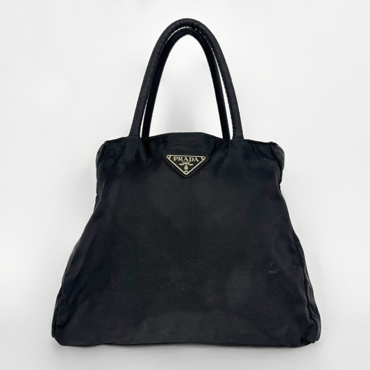Prada black nylon tote bag with top handles and the classic enamel triangle logo.
