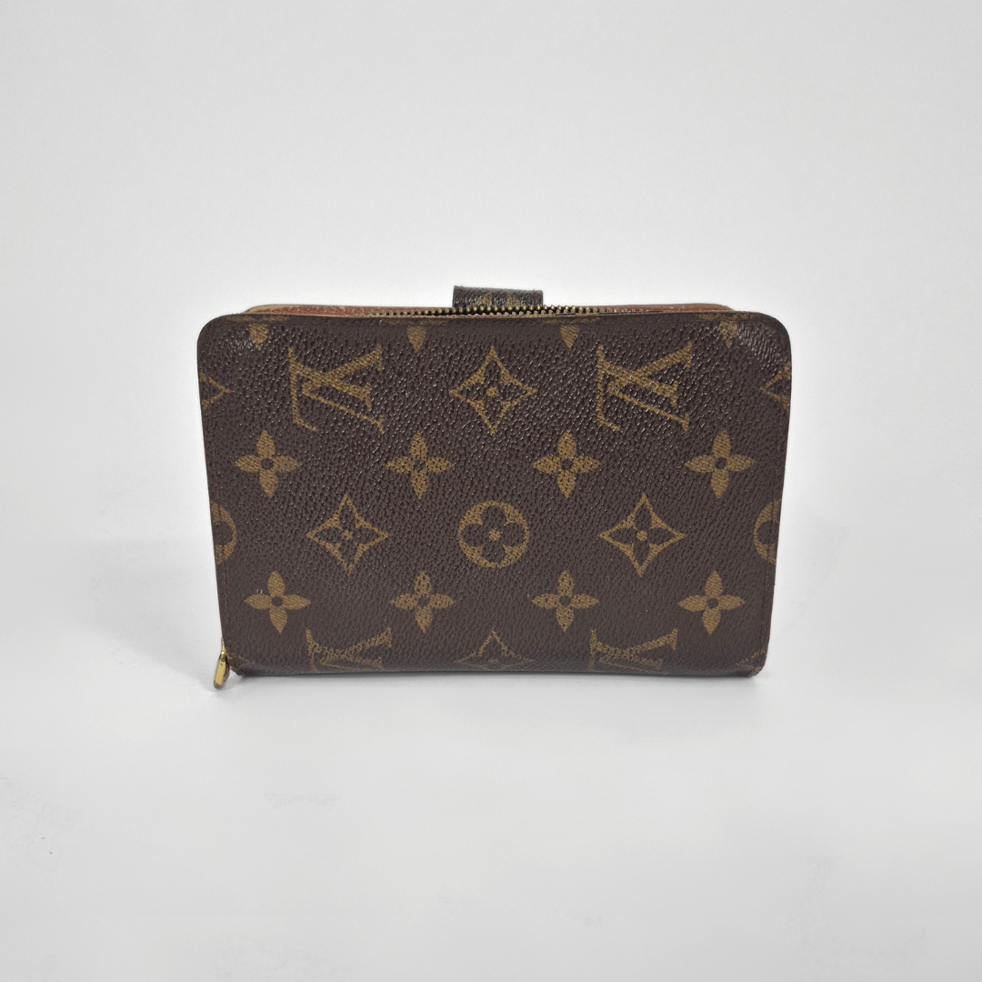 Louis Vuitton wallet with monogram pattern on a white background