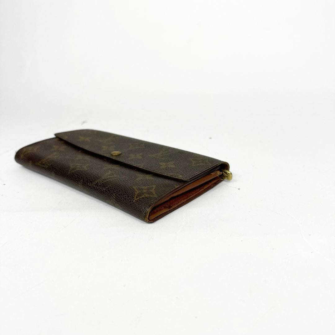 Brown leather wallet with pattern on a white background