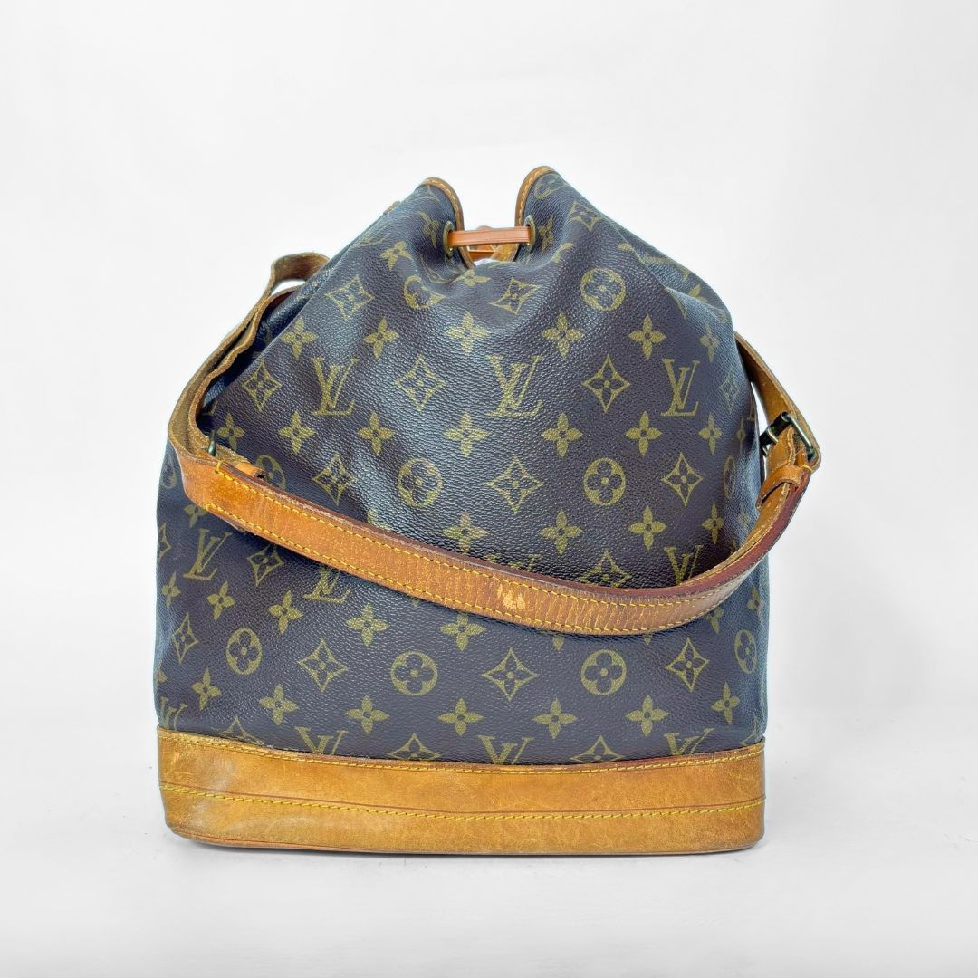 Brown monogram LV handbag with tan leather accents on a white background