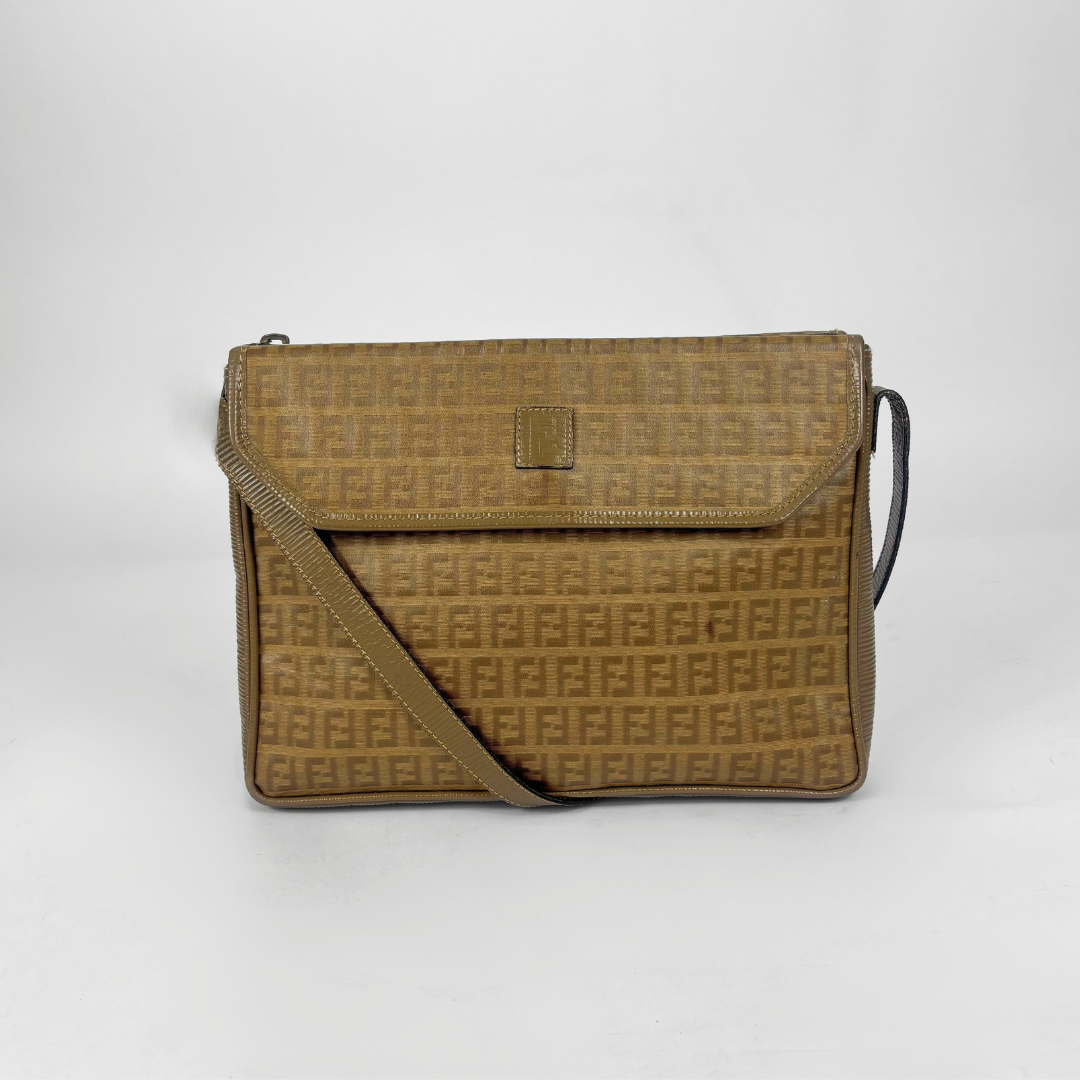 Brown patterned handbag on a white background