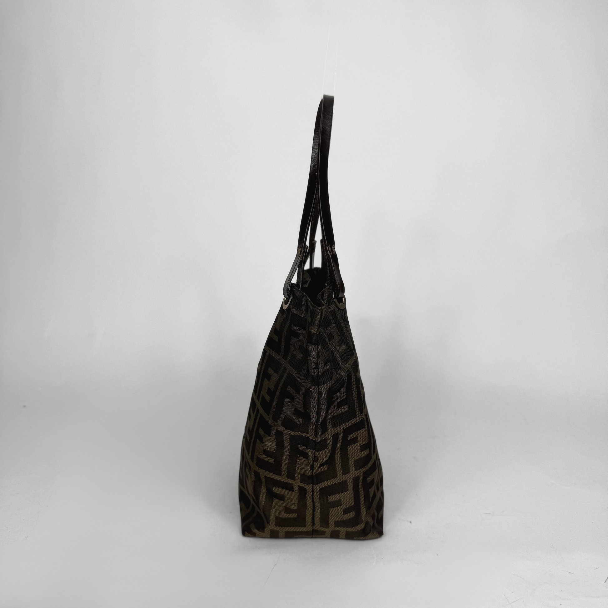 Black patterned handbag on a white background