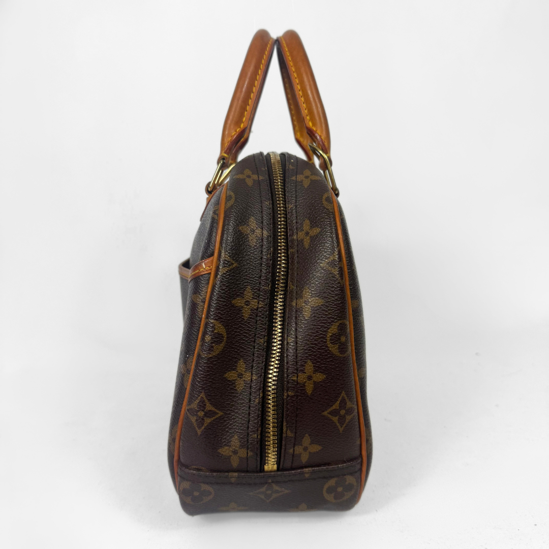 A Louis Vuitton monogram canvas handbag shown from the side profile against a plain white background.