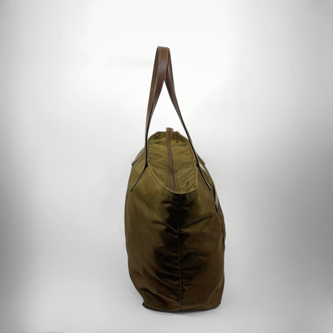 Green bag with brown handle on a white background