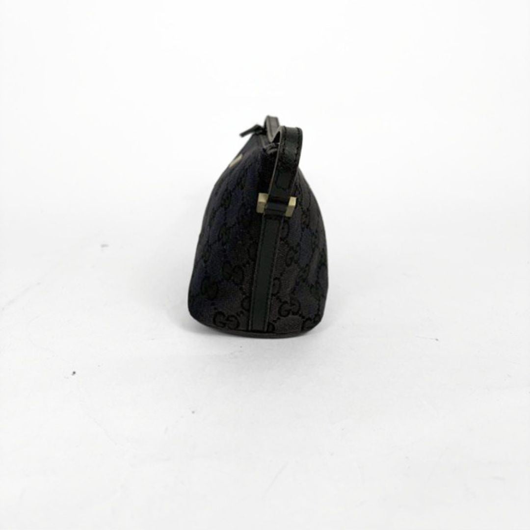 Black handbag with a pattern on a white background