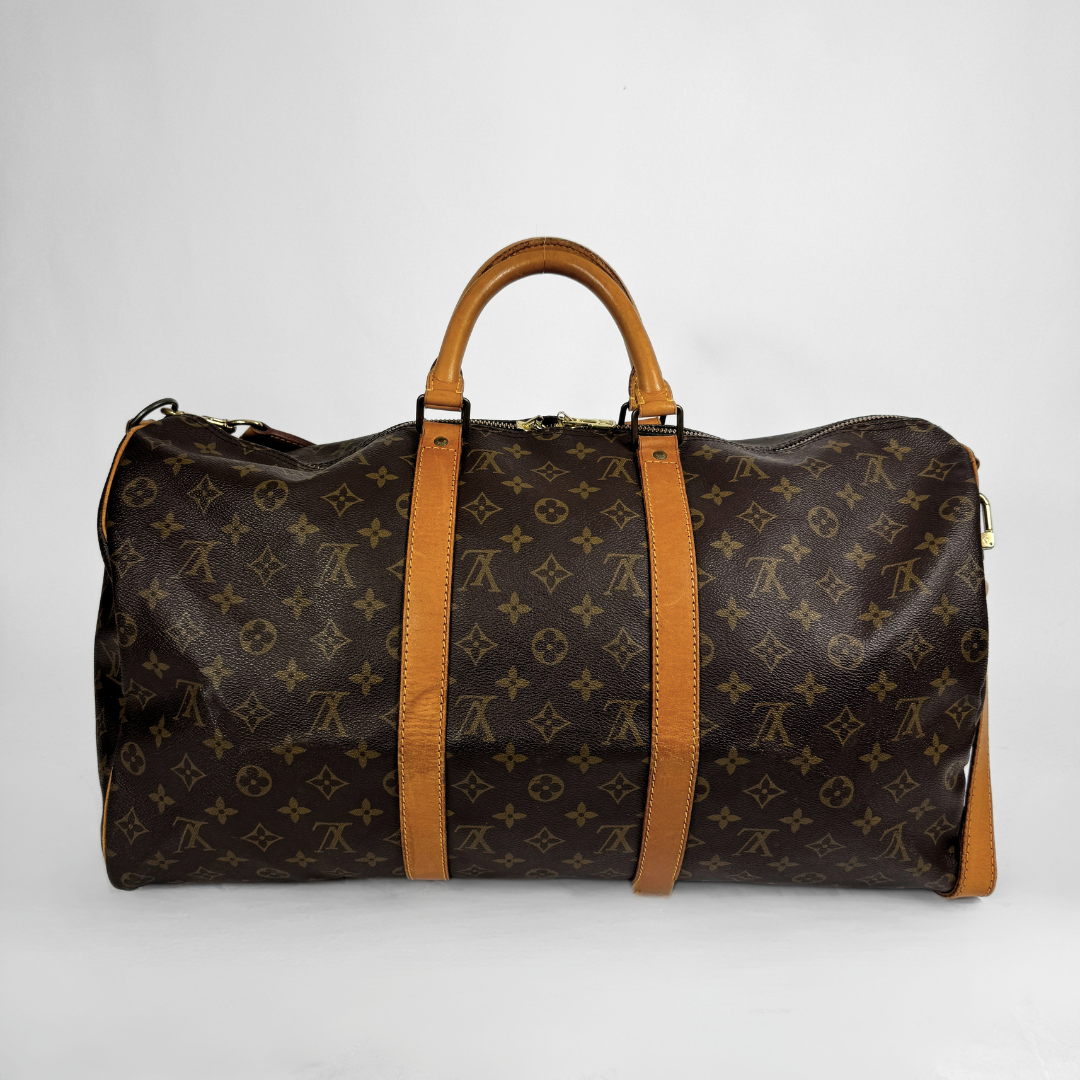 Louis Vuitton Keepall 50 with strap on a white background 