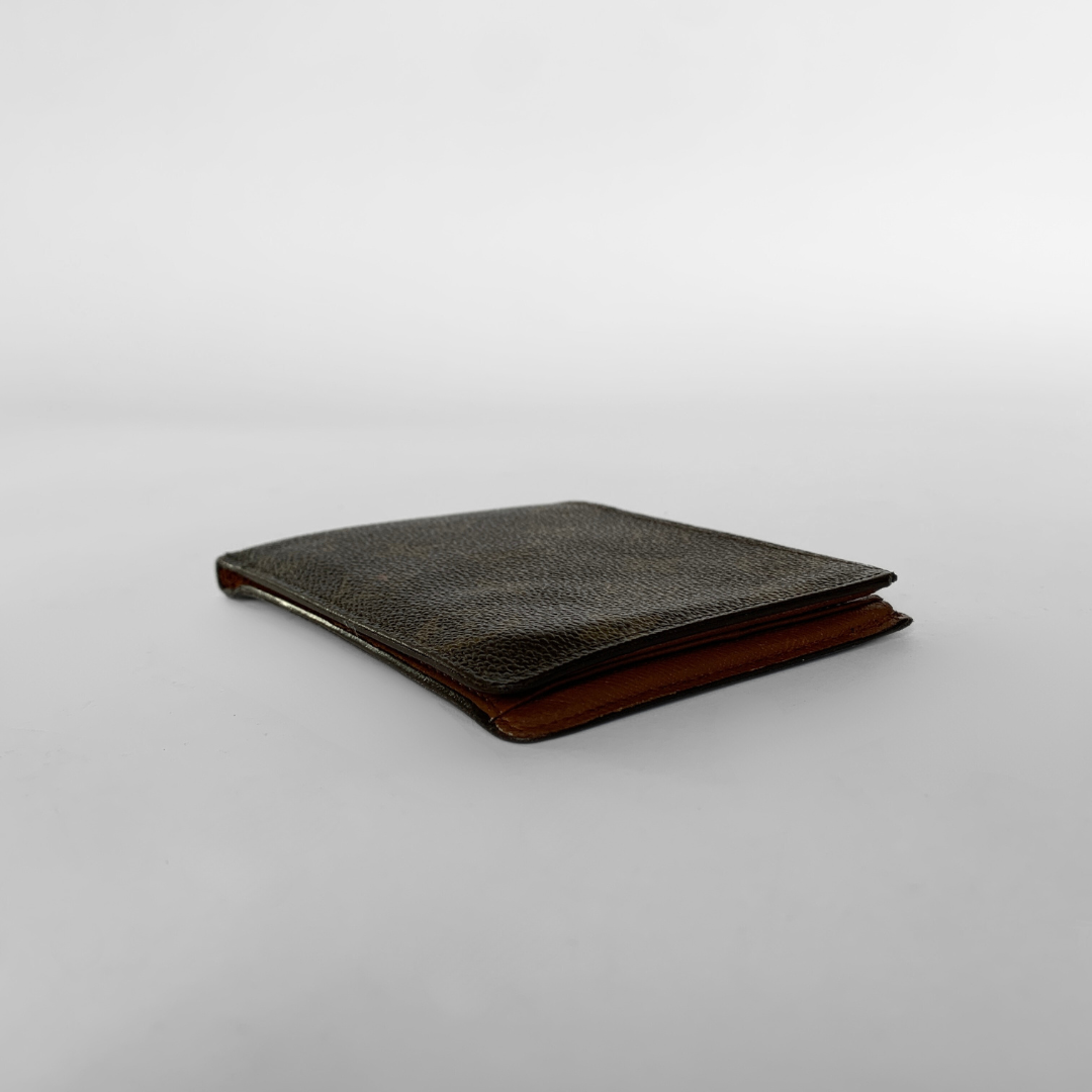A Louis Vuitton monogram bifold wallet in dark brown coated canvas with the classic tan/gold LV monogram pattern, shown against a neutral light gray background.