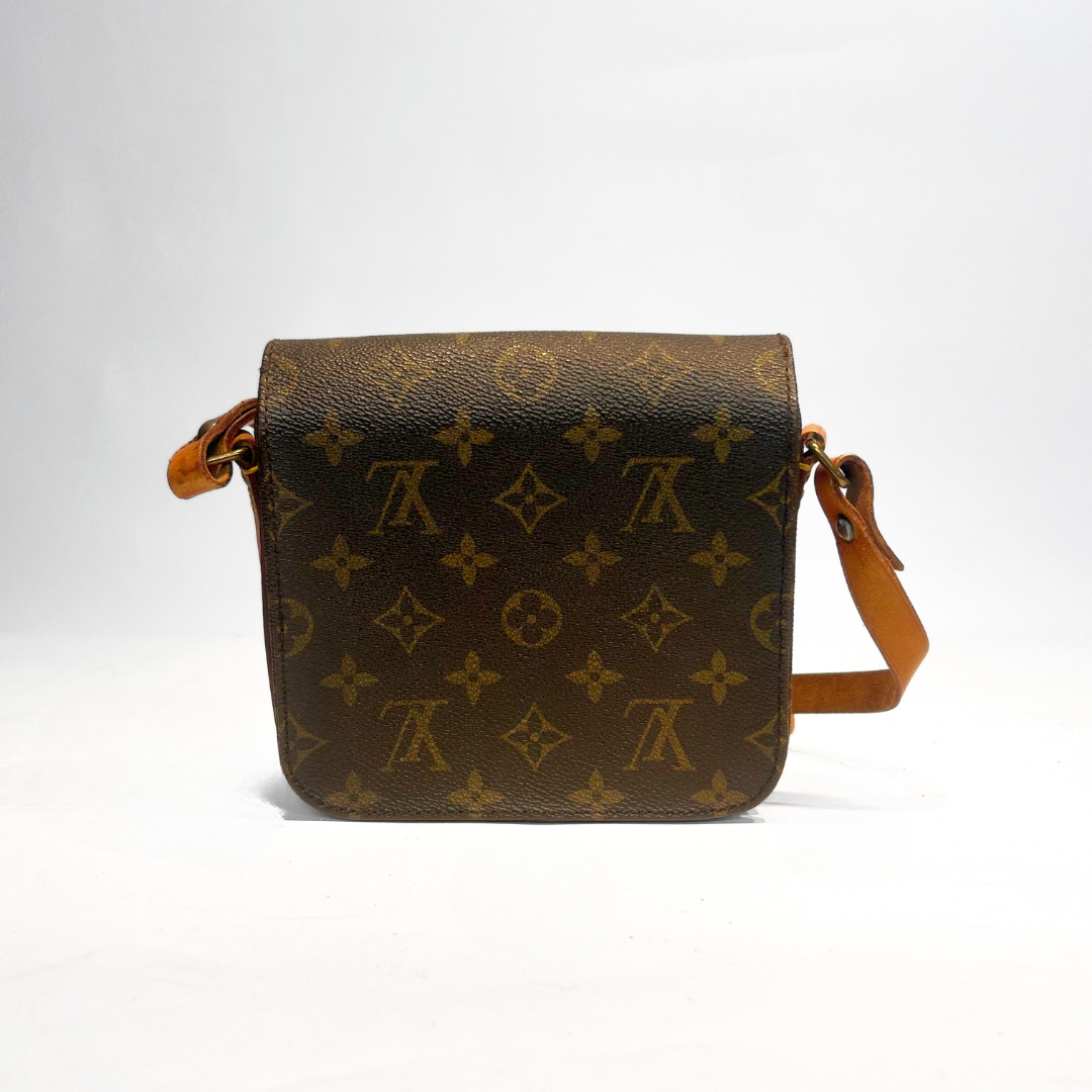 Louis Vuitton Cartouchière PM Monogram Canvas on a white background