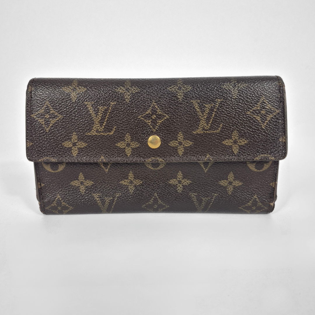 Brown wallet with monogram pattern on a white background