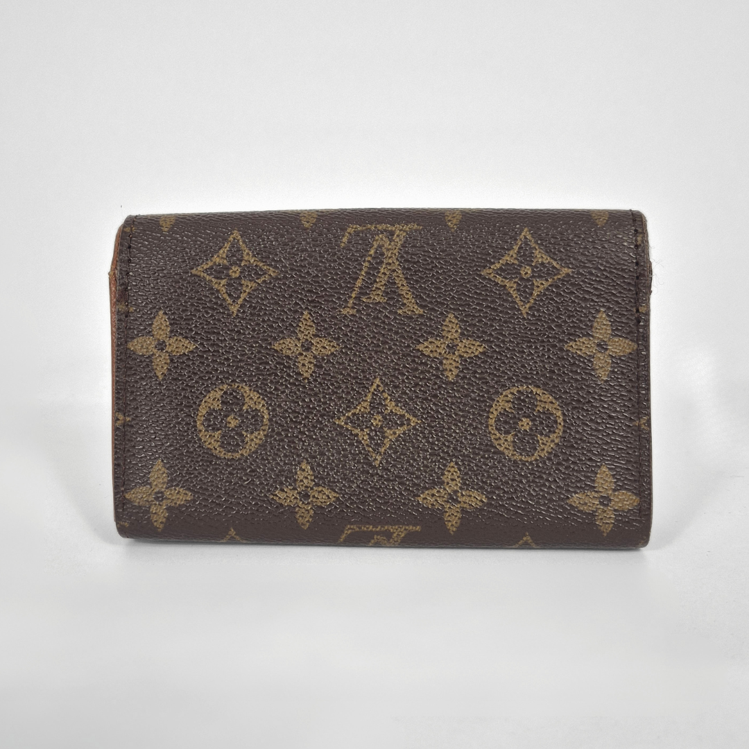 Brown wallet with pattern on a white background