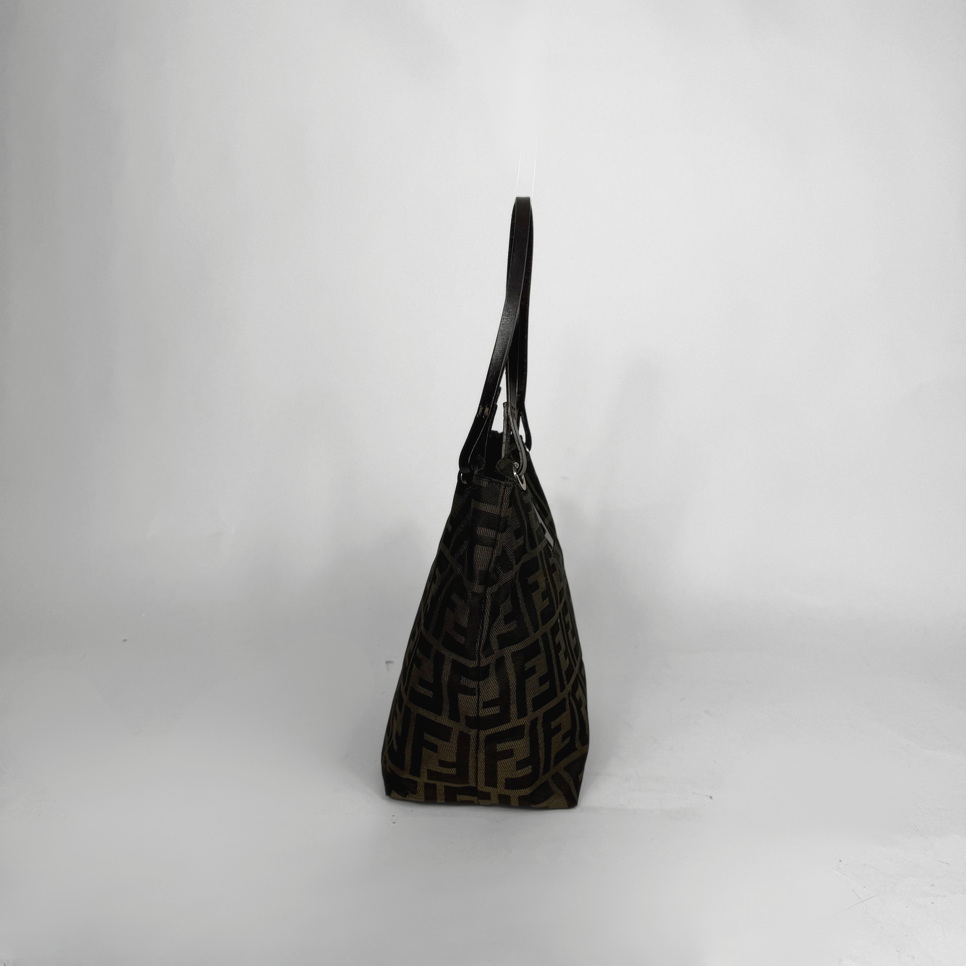 Black textured handbag on a white background