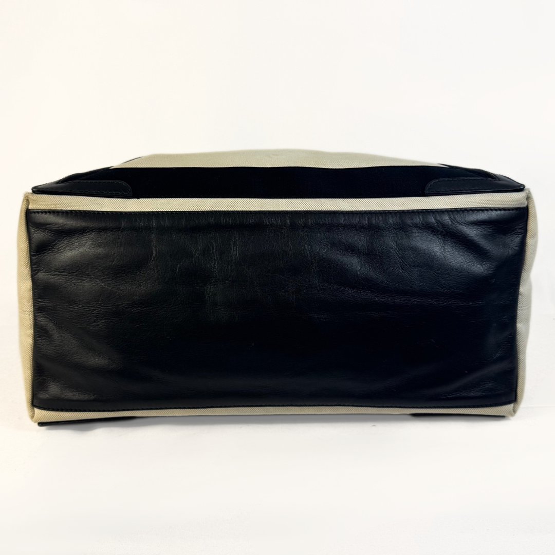 Balenciaga tote bag with black accents on a light gray background