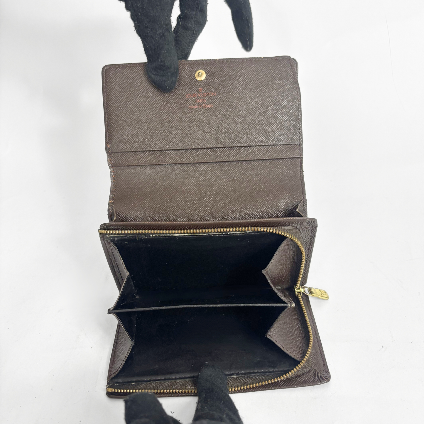 Louis vuitton wallet in brown Damier Ebene checkered canvas with a snap-button closure.
