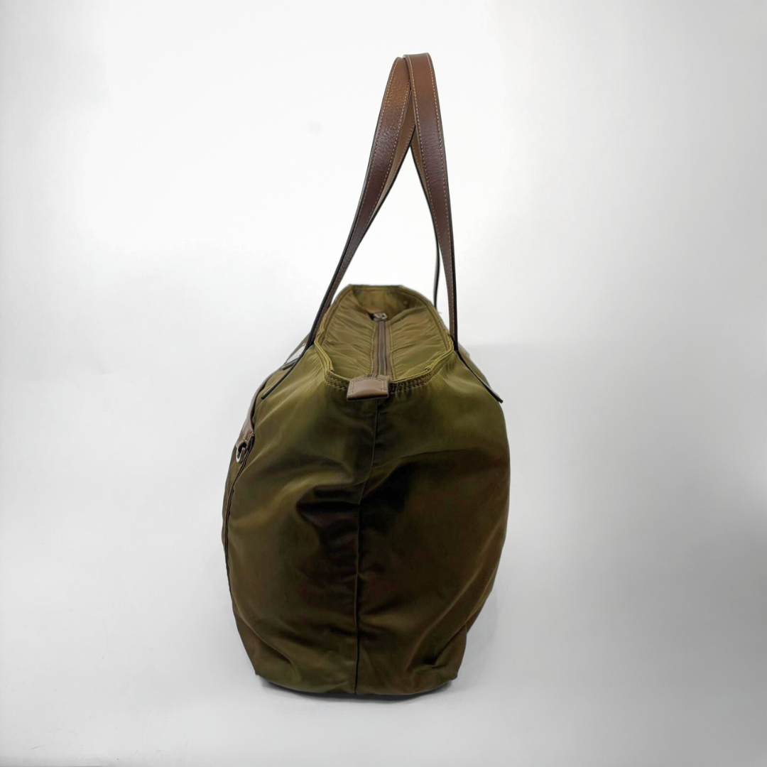 Green bag with brown handle on a white background