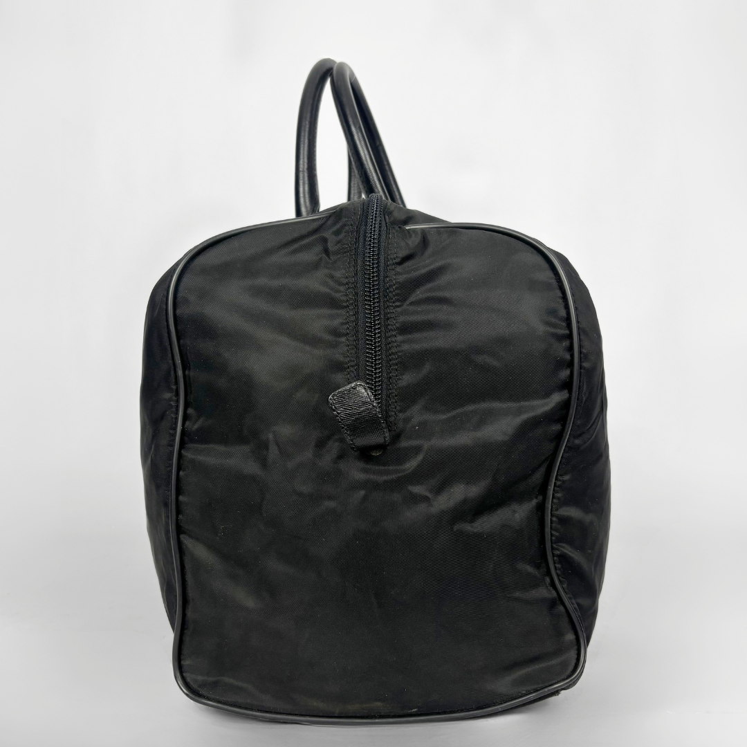 Black backpack with a strap and lock on a white background