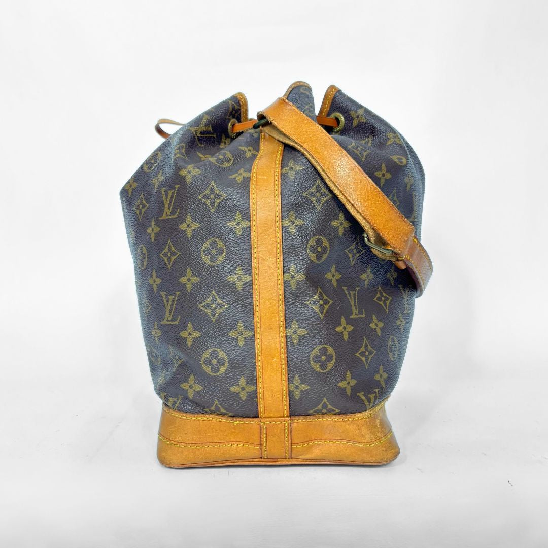 Designer handbag with monogram pattern on a white background