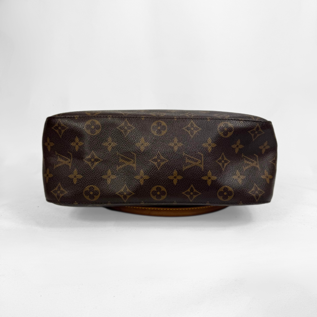 Louis Vuitton monogram canvas handbag shown from the bottom, featuring the classic dark brown and tan monogram pattern on a white studio background.