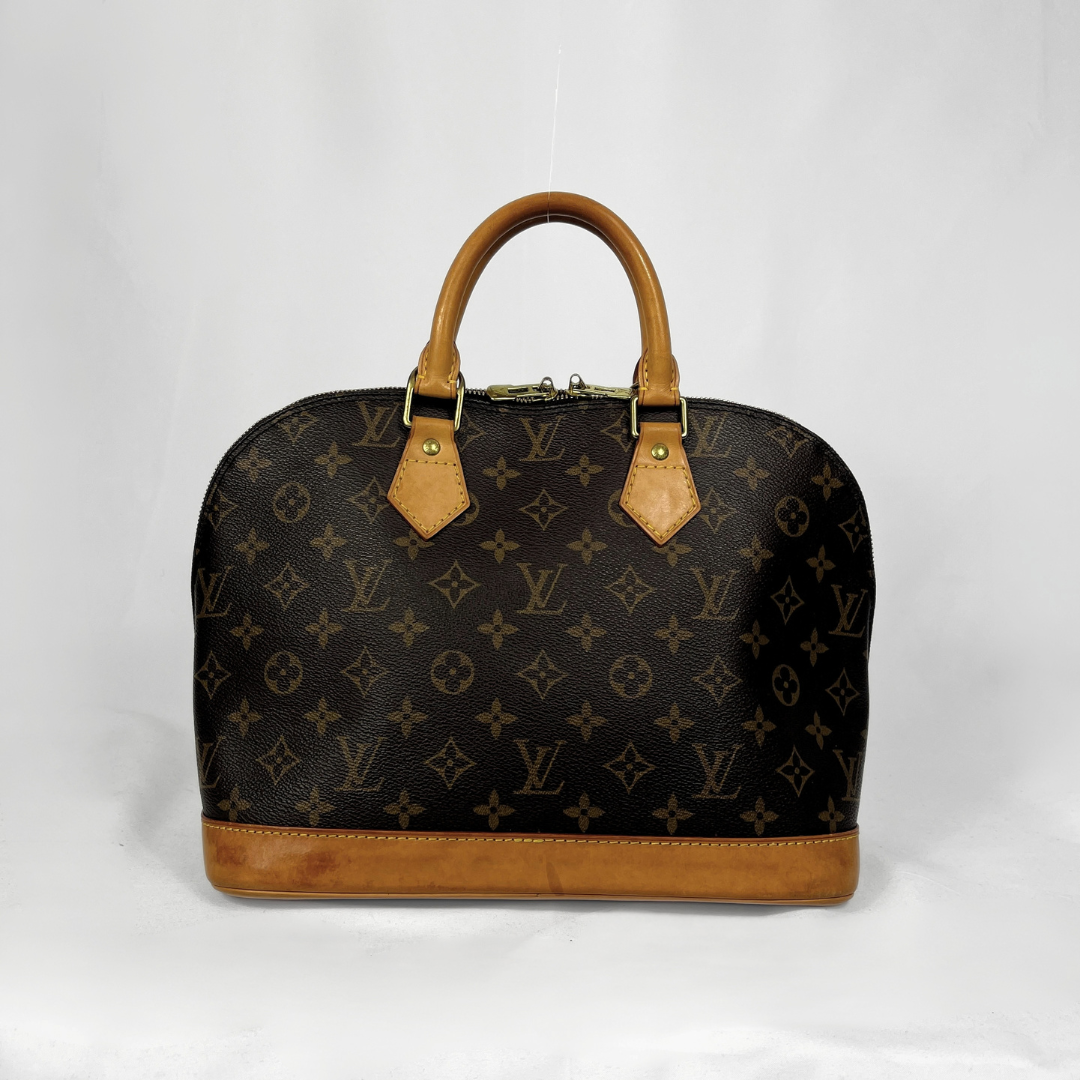 Louis Vuitton Alma Monogram Canvas on a white background