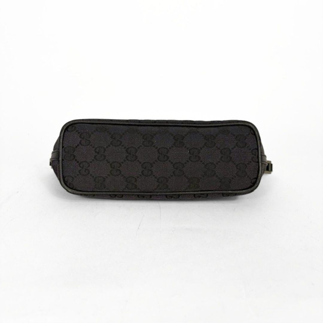 Black patterned pouch on a white background