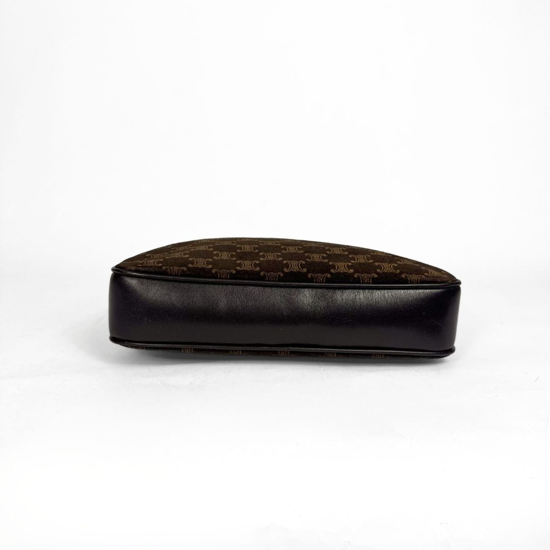 Black and brown patterned cushion on a white background