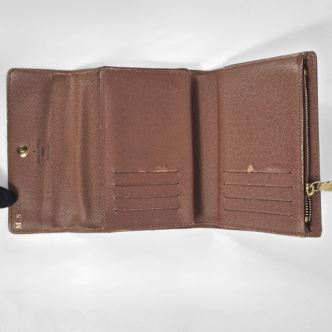 Brown leather wallet open on a white background