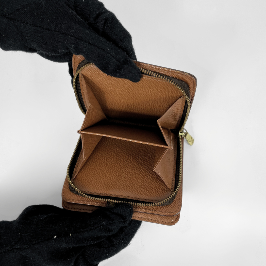 Louis Vuitton Zipper Wallet on a white background