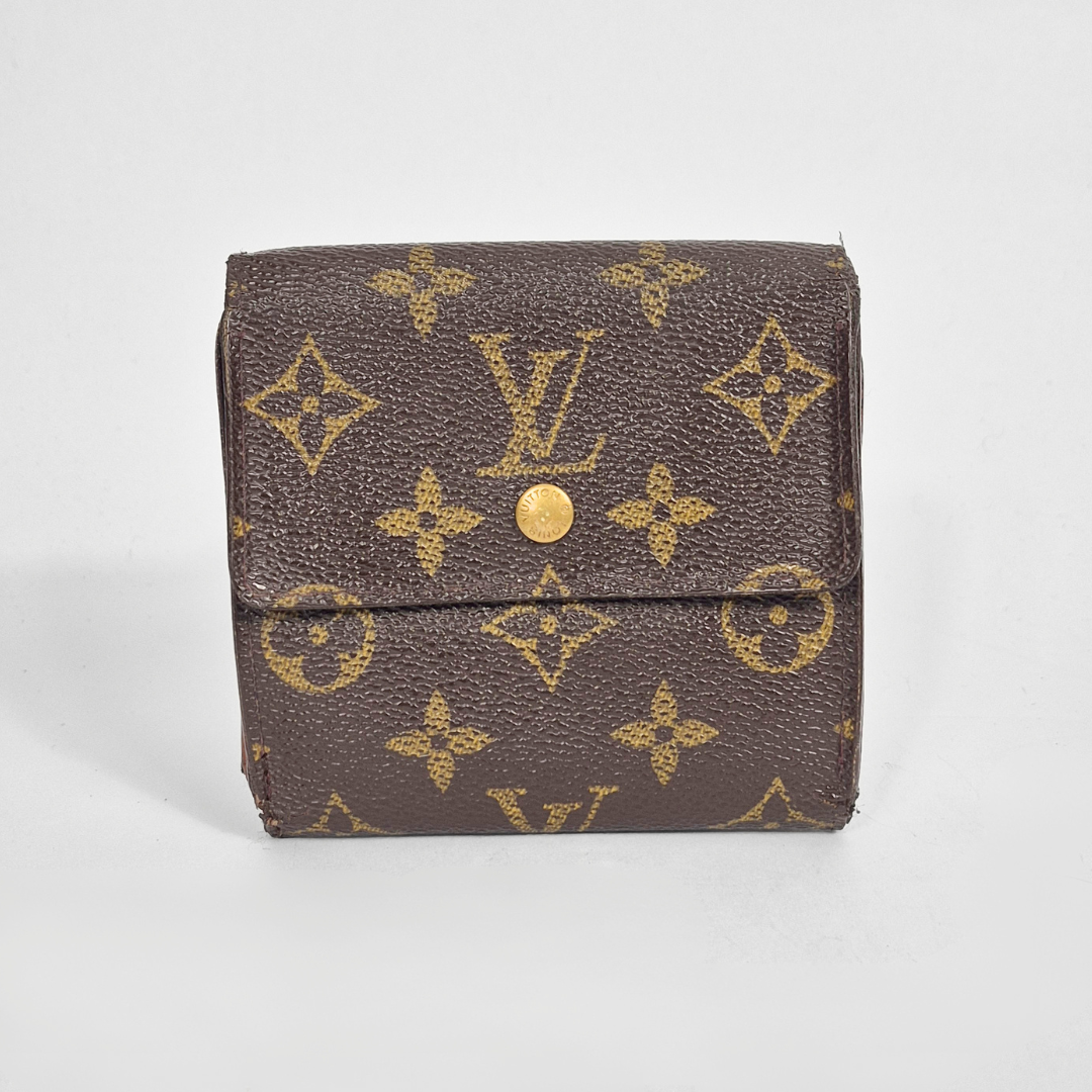 Louis Vuitton wallet with monogram pattern on a light gray background