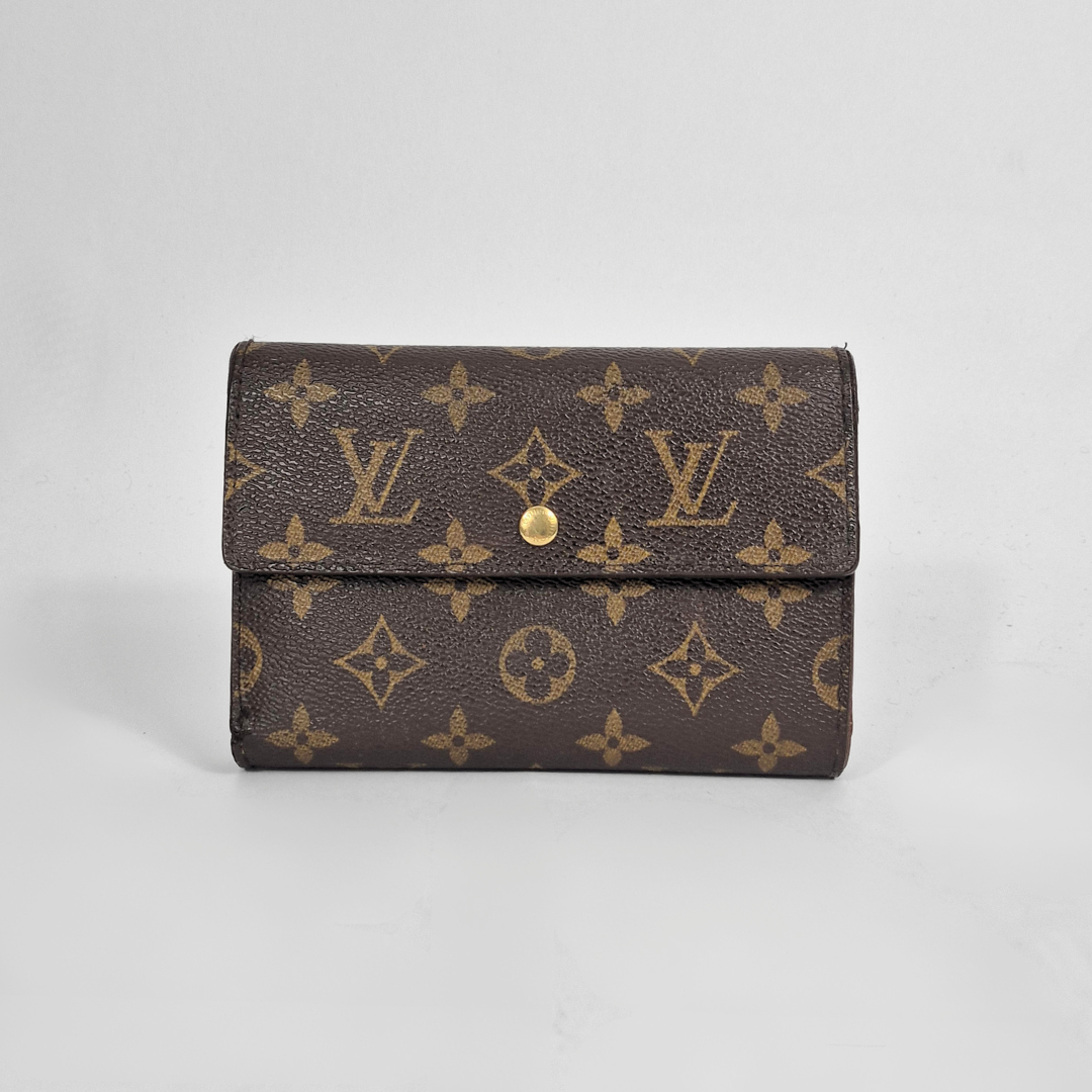 Louis Vuitton Cartera con estampado de monogramas sobre fondo gris claro