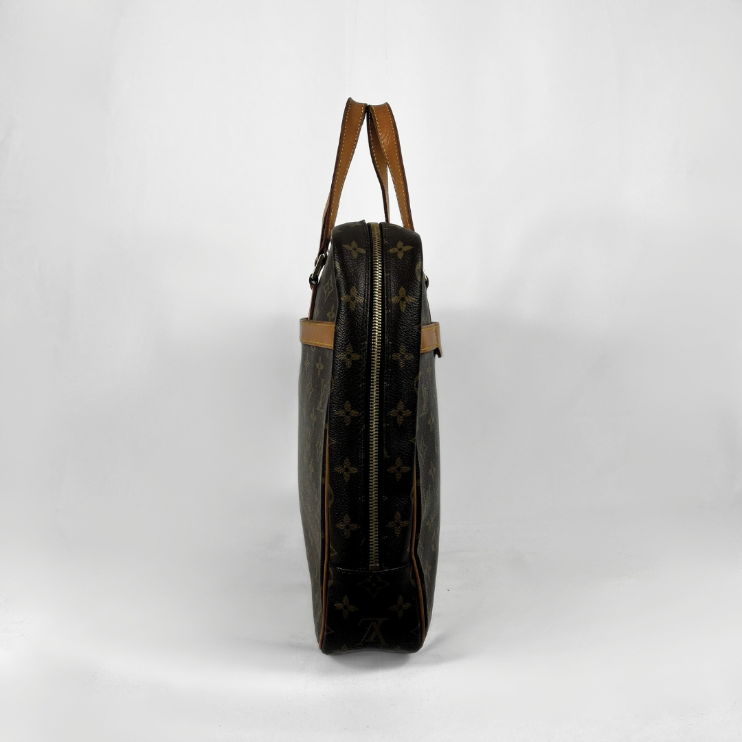 A Louis Vuitton monogram canvas shoulder bag shown from the side profile against a plain white studio background.