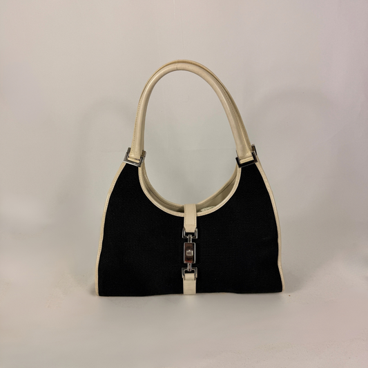 Gucci Jackie Bolso de hombro de lona negra y piel blanca.