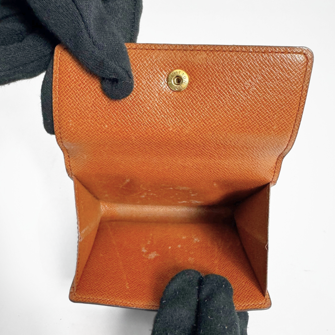 Louis Vuitton Druk Wallet on a white background