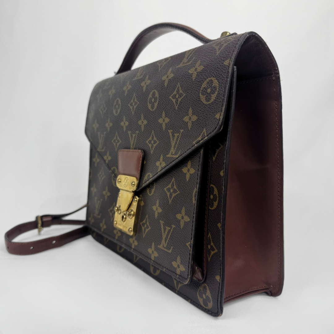 Louis Vuitton Monogram Pochette Accessoires satchel bag in dark brown coated canvas with gold-tone hardware and a brown leather strap, shown on a white background.